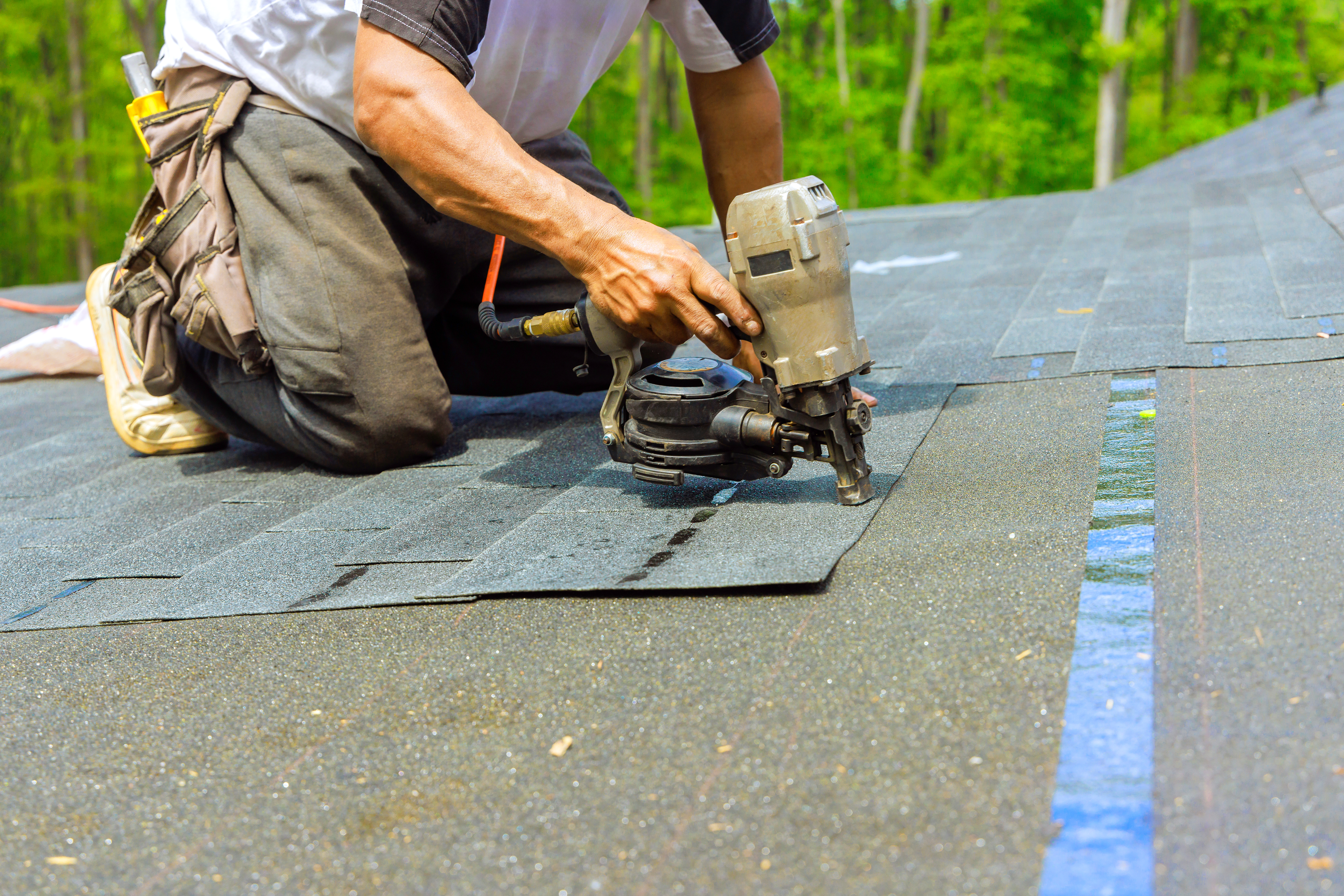 Worker with nail gun